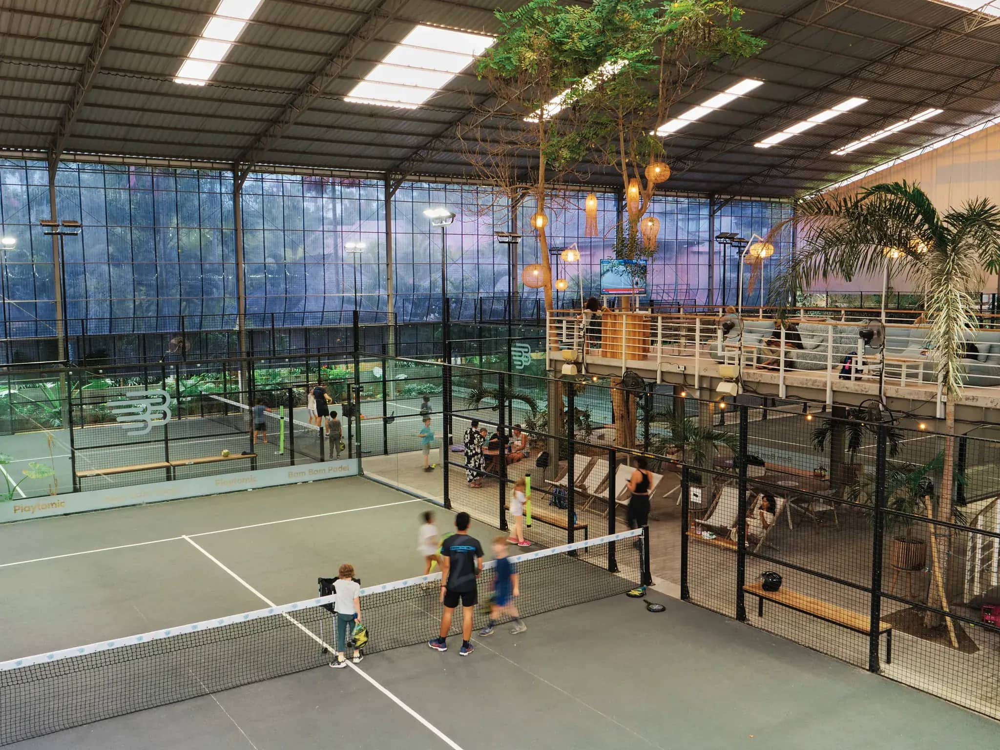 A covered padel court at Bam Bam Padel in golden-hour light