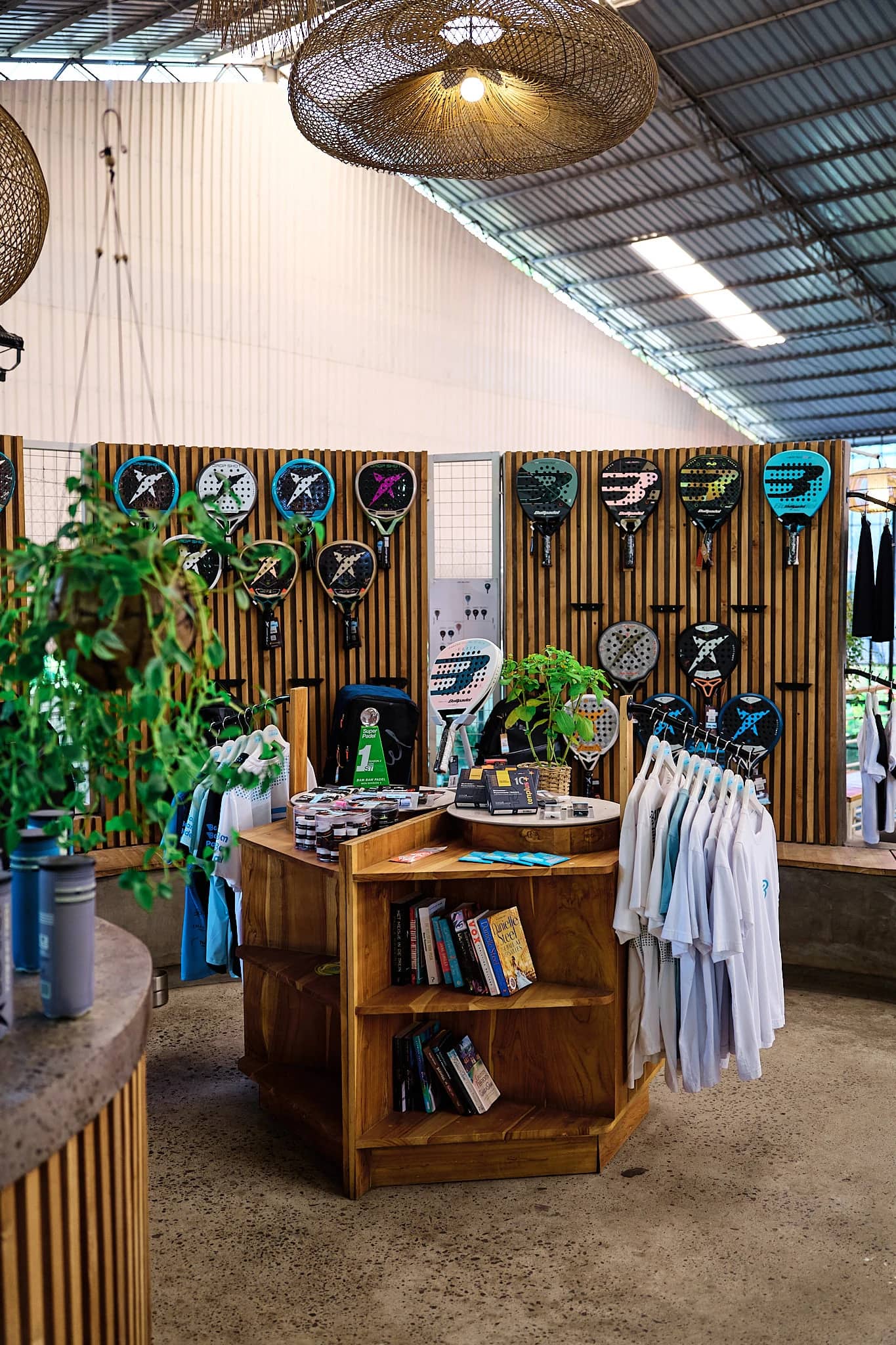 The pro-shop at Bam Bam Padel, rackets and apparel on display