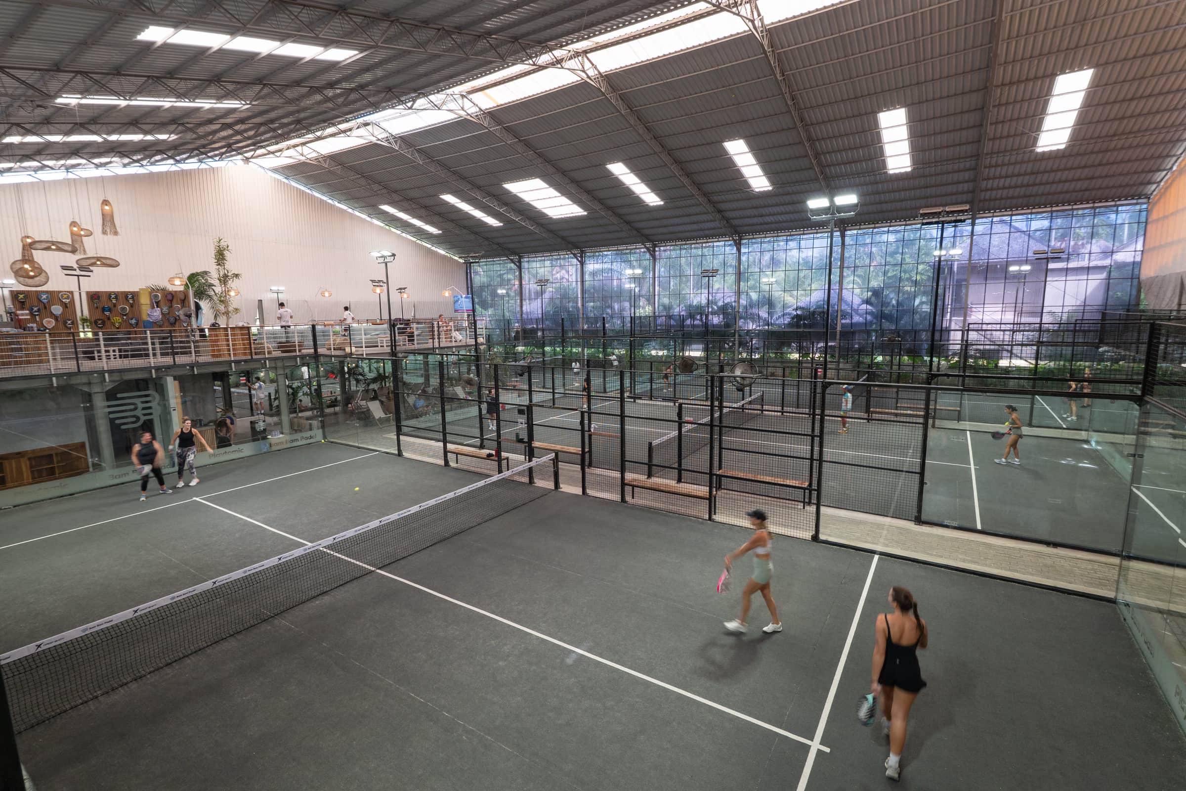 A covered padel court at Bam Bam Padel in golden-hour light
