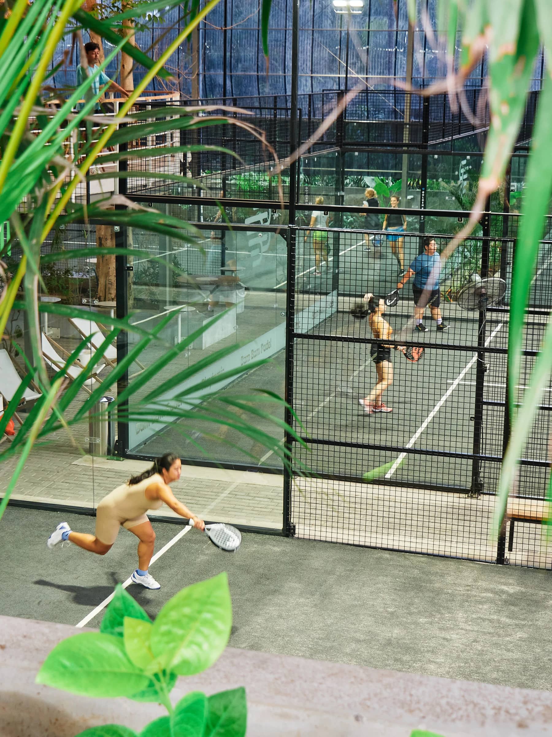 An adult padel coaching session at Bam Bam Padel